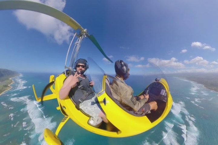 a man flying through the air while riding a wave on a surfboard
