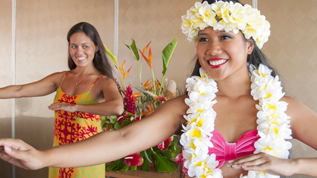 a woman holding a birthday cake