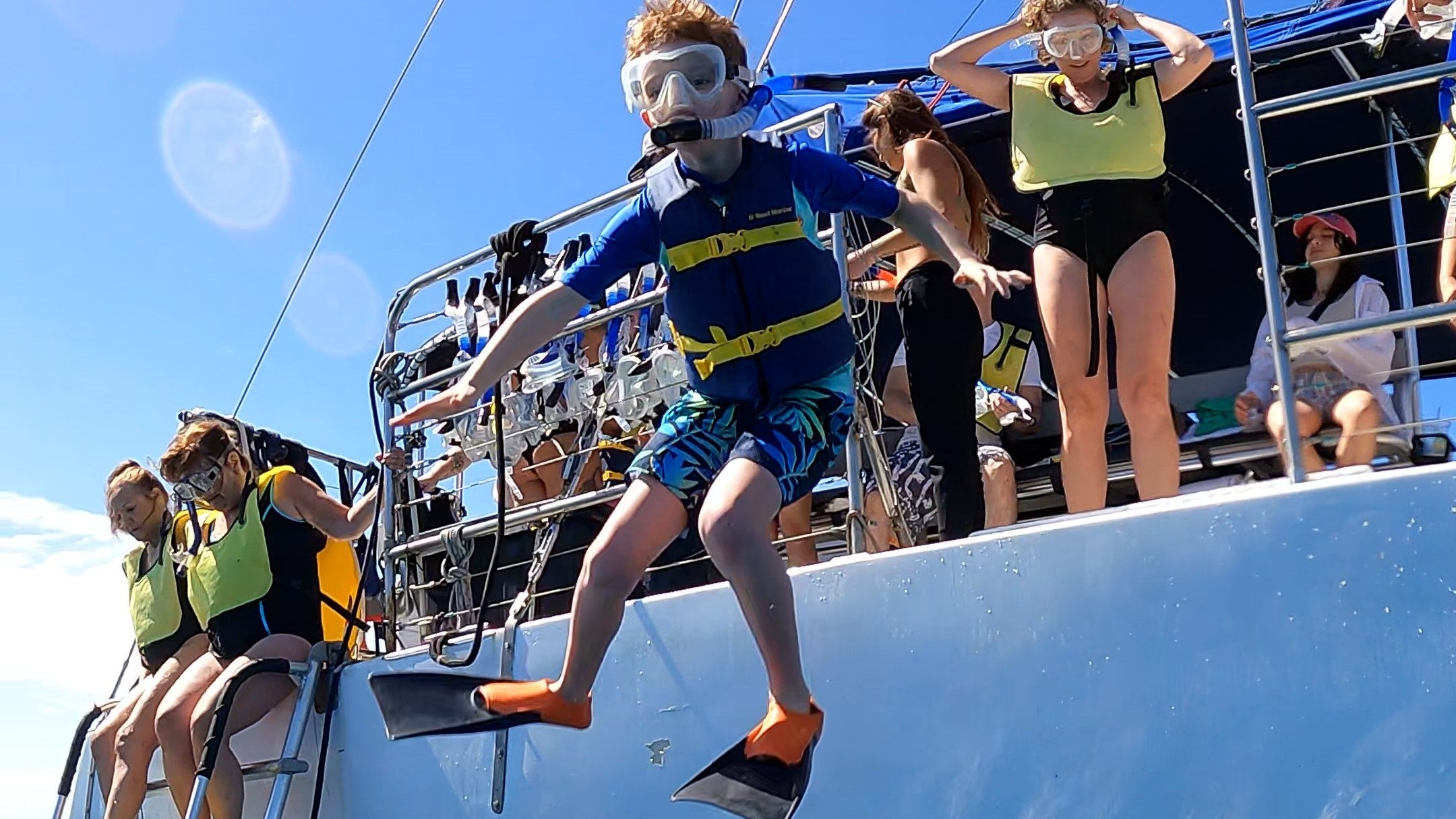 a group of people riding on the back of a boat