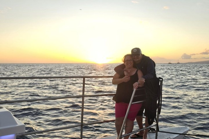 a person standing next to a body of water