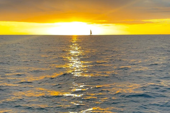 a sunset over a body of water