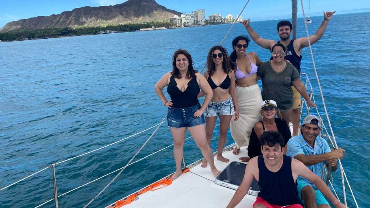 a woman standing next to a body of water