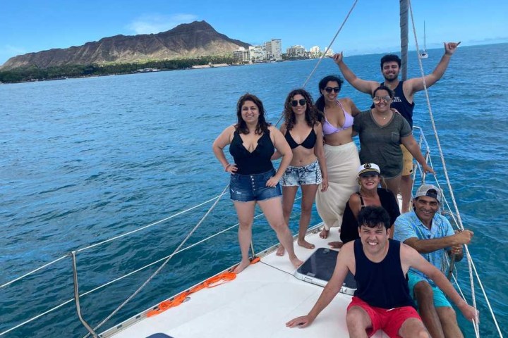 a woman standing next to a body of water