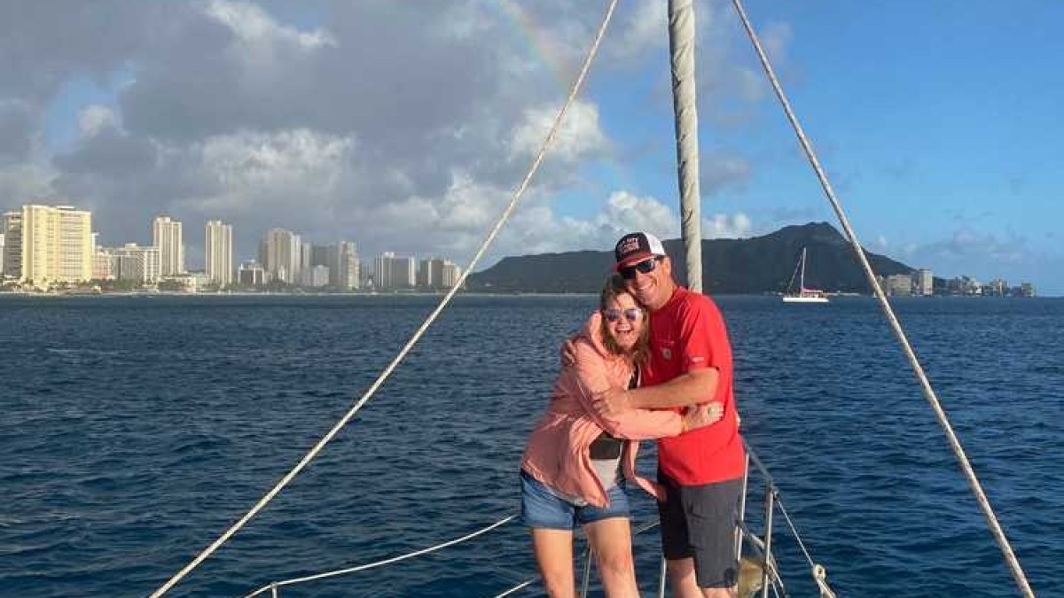 a person riding on the back of a boat in a body of water