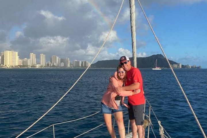 a person riding on the back of a boat in a body of water