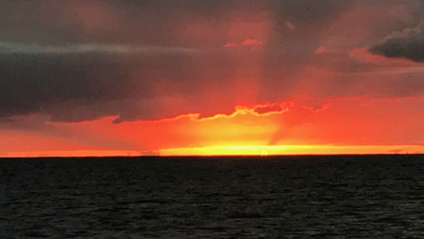 a sunset over a body of water