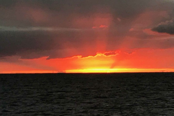 a sunset over a body of water