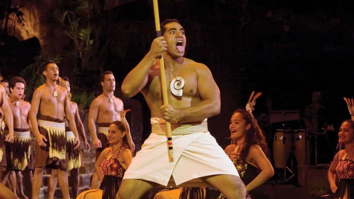 a group of people standing in front of a crowd