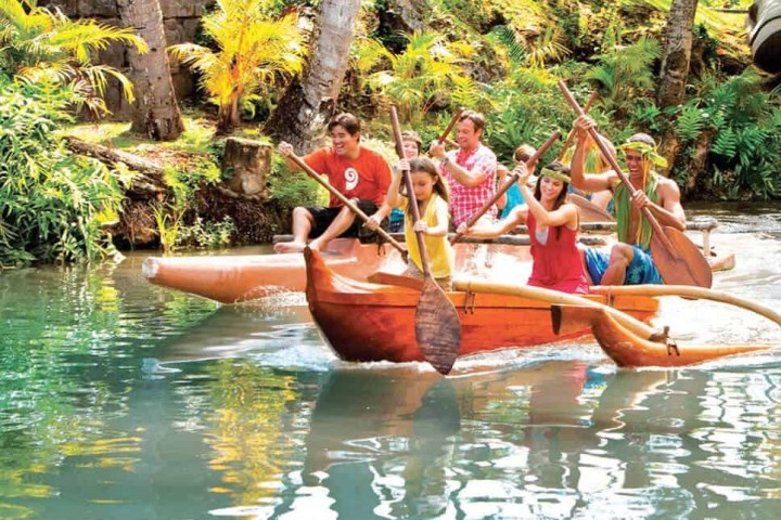 a group of people on a boat in the water