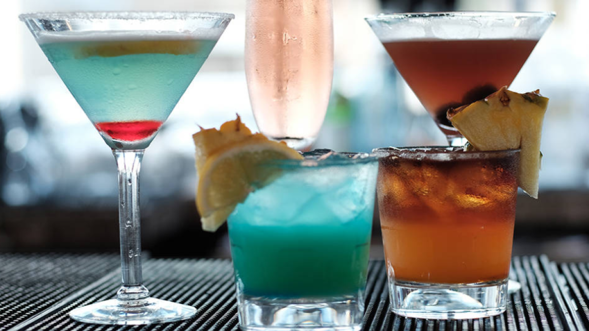 a glass of wine sitting on top of a table